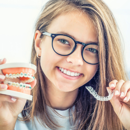 Metal braces and clear aligners, both popular treatments at Heaton mersey orthodontic centre