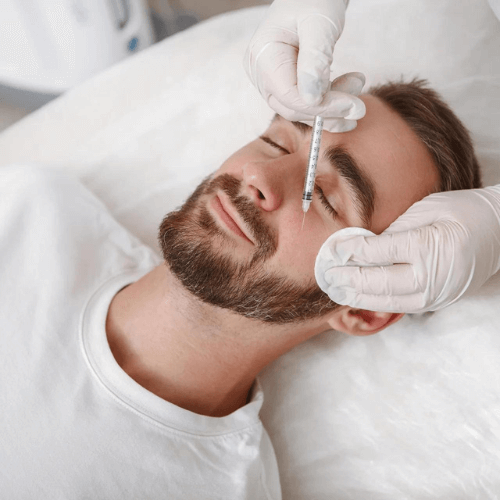 man having dermal fillers and botox injected for reducing and preventing wrinkles with facial aesthetics
