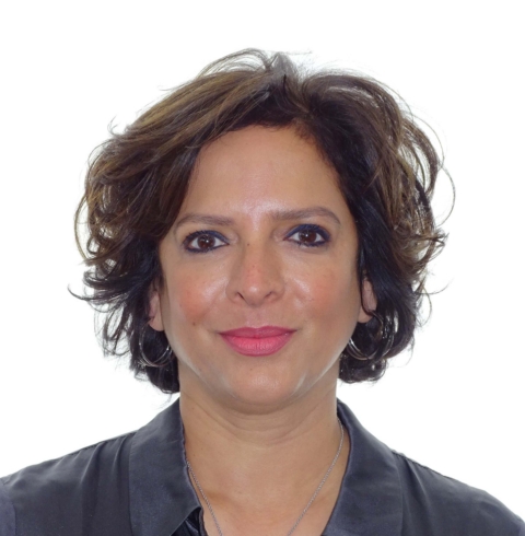 Dr. Tazeen Usmani at Heaton Mersey Orthodontic Centre, smiling towards the camera.