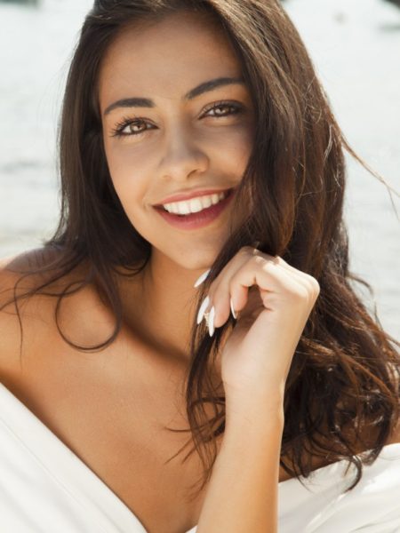 Lady smiling after receiving Damon Clear Braces treatment with us, Heaton Mersey Orthodontic Centre, in Stockport, Manchester.