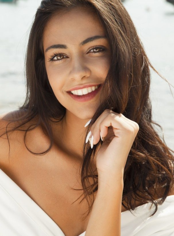 Lady smiling after receiving Damon Clear Braces treatment with us, Heaton Mersey Orthodontic Centre, in Stockport, Manchester.