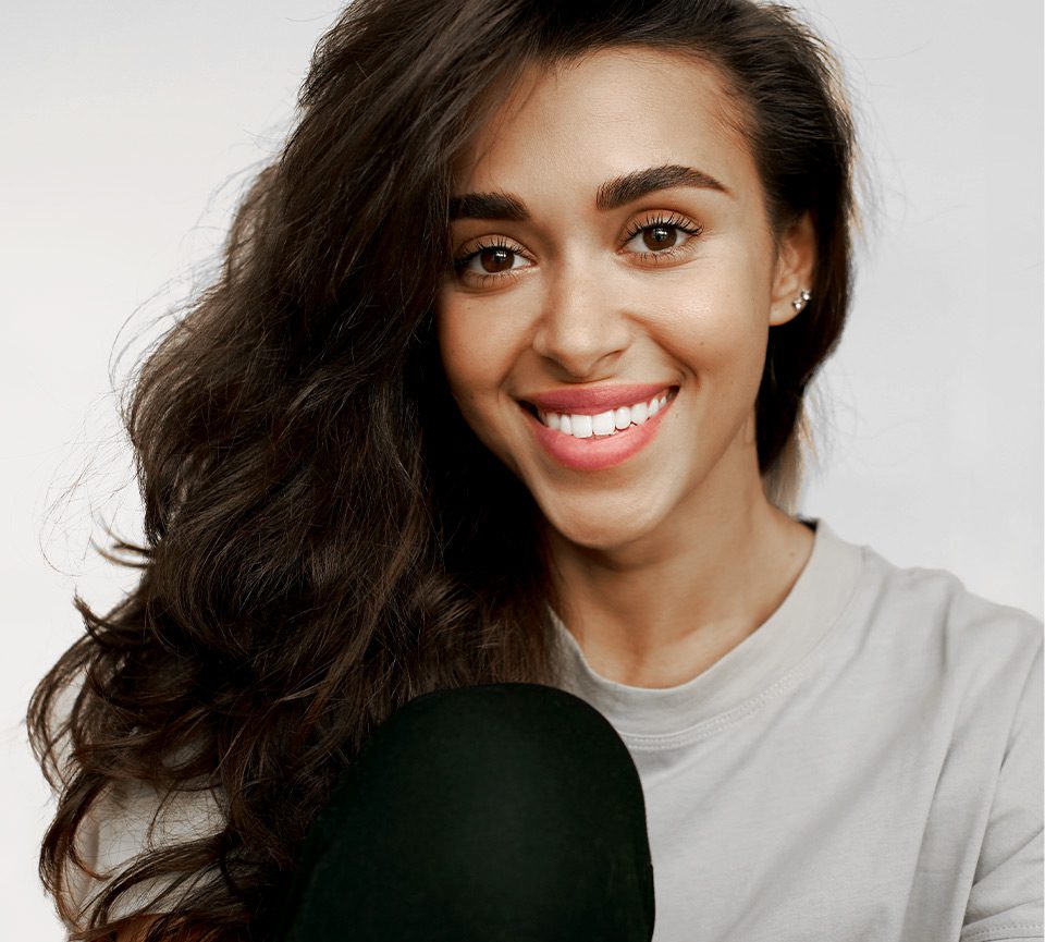 Woman smiling after Orthodontic treatment at Heaton Mersey in Manchester