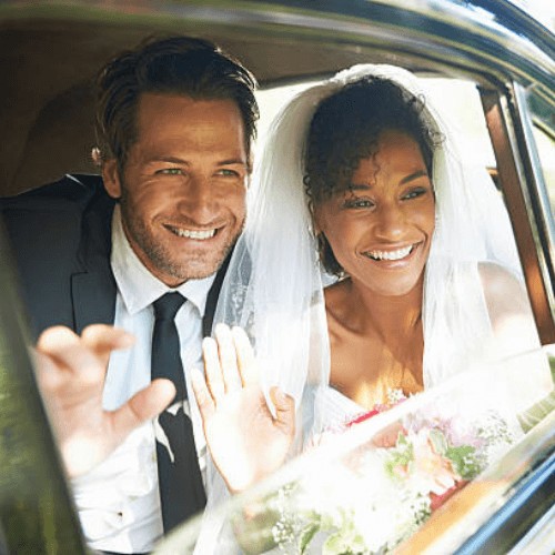 bride and groom both with a nice white smile in Stockport, Greater Manchester