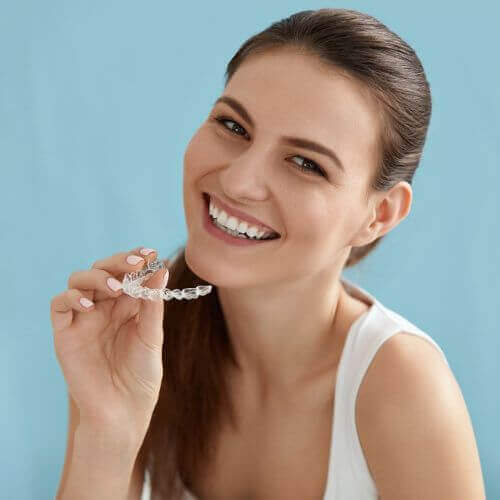 woman smiling with invisalign clear aligners stockport