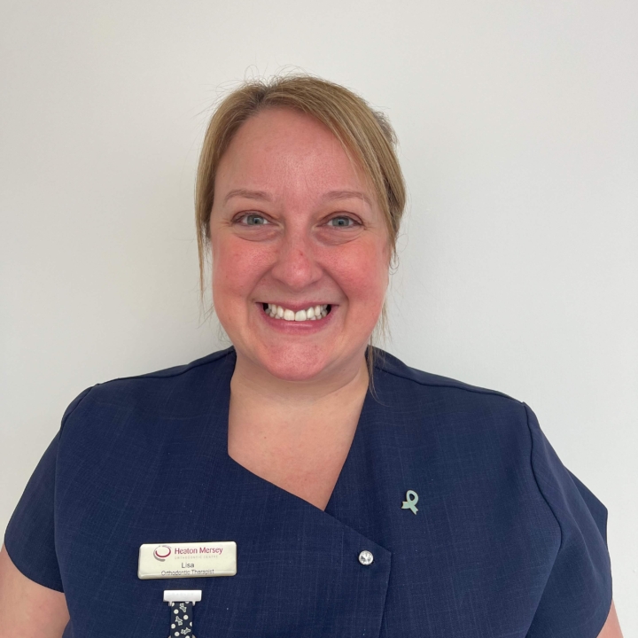 Lisa, orthodontic therapist at Heaton Mersey Orthodontic Centre, smiling towards the camera.