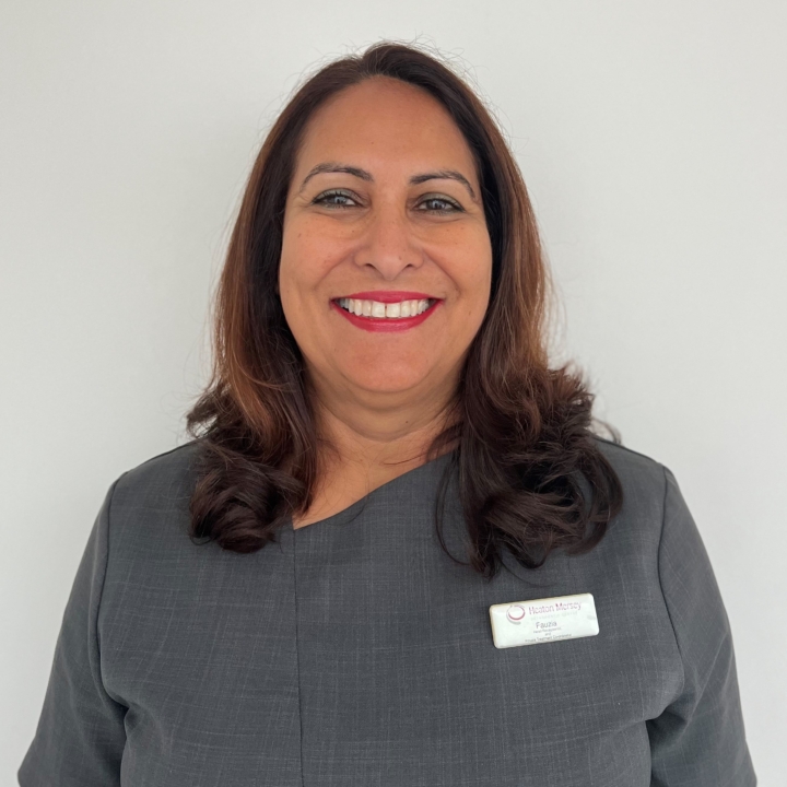 Fauzia, a member of Heaton Mersey orthodontic centre, smiling at the camera.