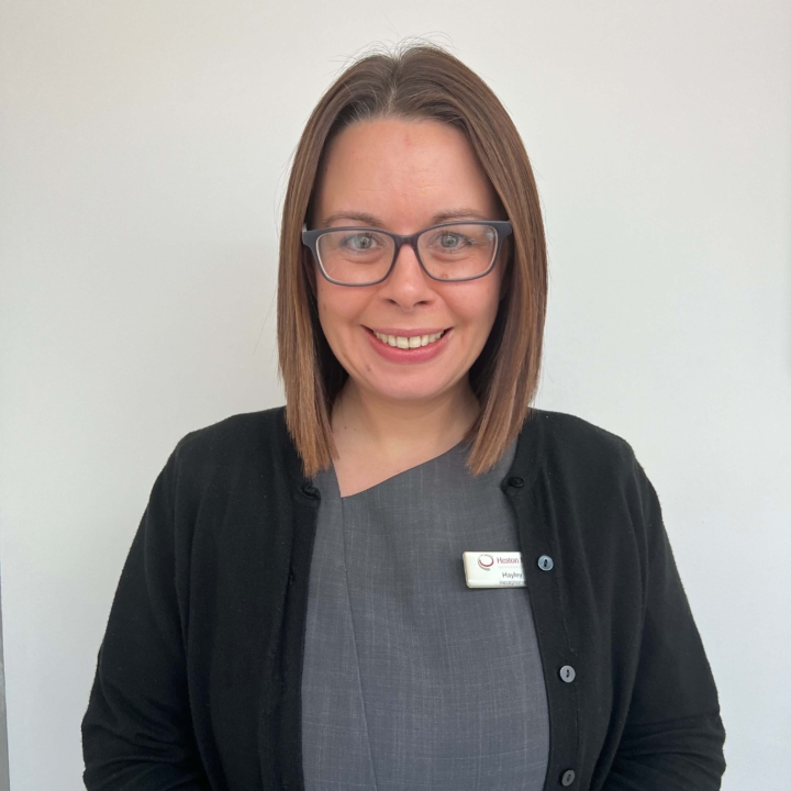 Hayley, a member at Heaton Mersey Orthodontic Centre, smiling at the camera.