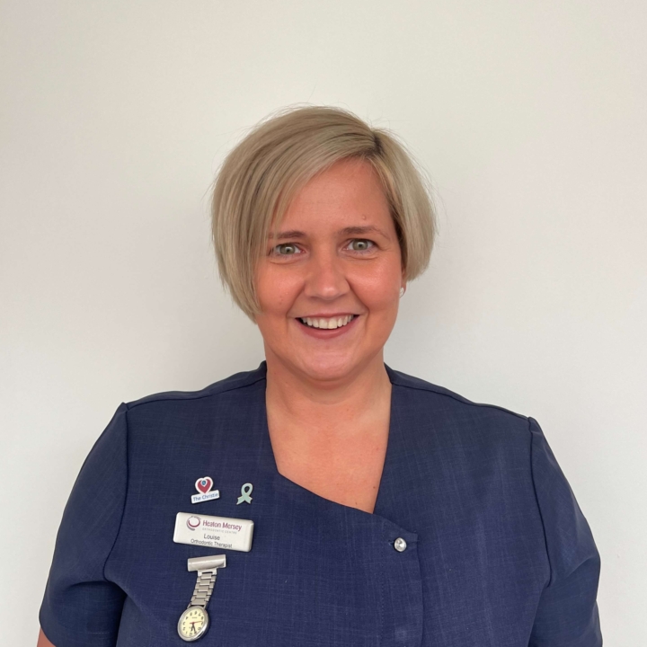 Louise, orthodontic therapist at Heaton Mersey Orthodontic Centre, smiling towards the camera.